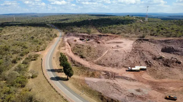 Drone view: borrow pit beside a rural road
