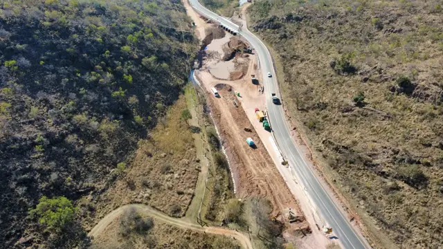 Drone view: road cut through a hillside
